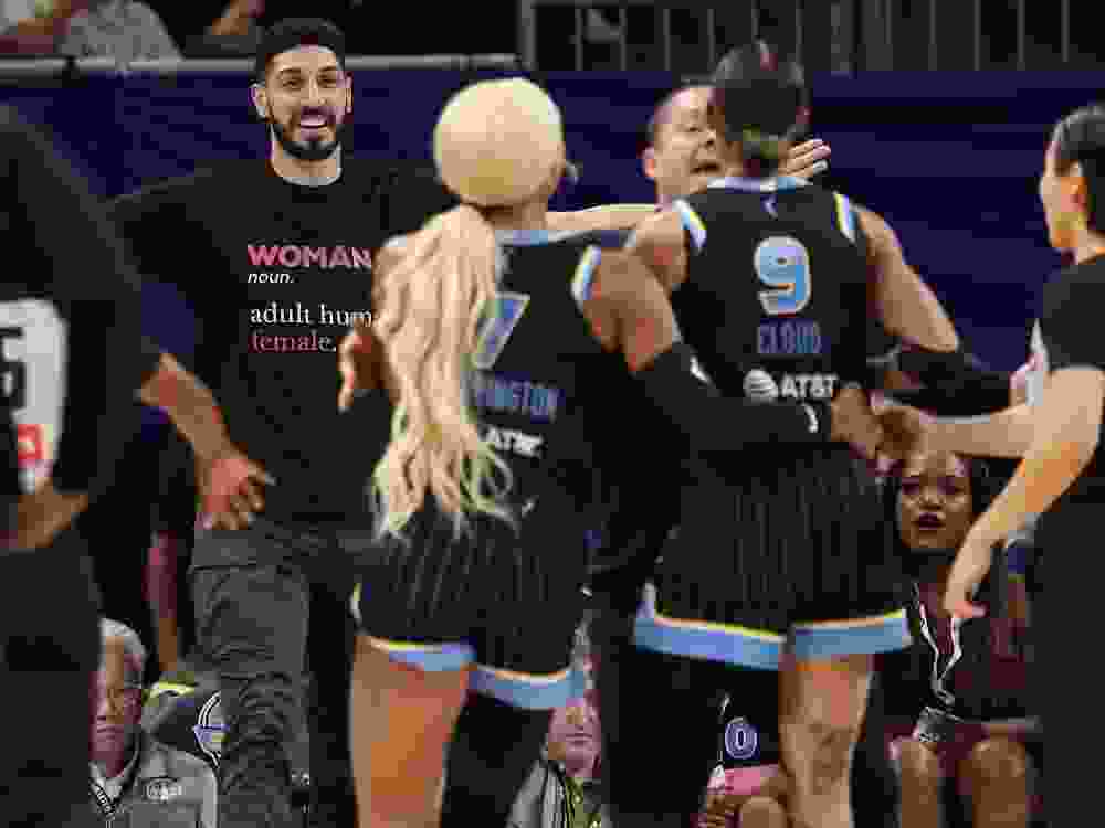 Former NBA player Enes Kanter Freedom and Natasha Cloud of the Chicago Sky yell at one another during a game against the Indiana Fever.