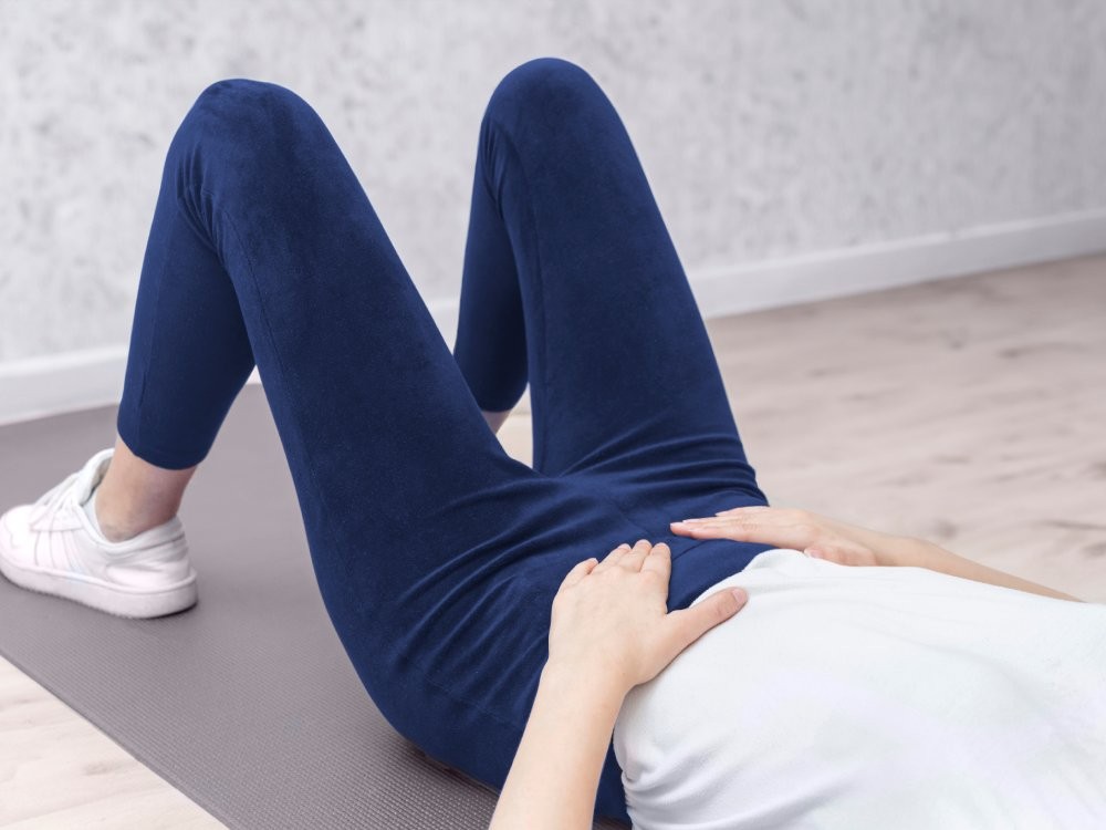 woman doing various sports moves - exercises for healthy life, pelvic floor exercise. Home sport workout. Elbows static balance stand. Floor stretching. Healthy lifestyle.