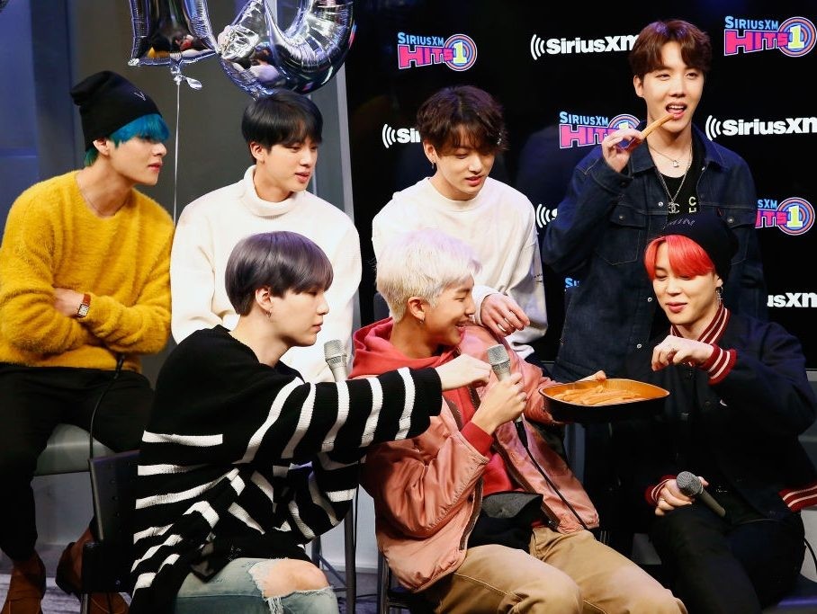 South Korean group BTS enjoy churros during a taping of The Morning Mash Up' On SiriusXM Hits 1 Channel at SiriusXM Studios on April 12, 2019 in New York City.