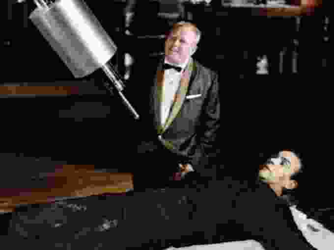 Gert Frobe as Goldfinger and Sean Connery as James Bond in the 1964 Bond film Goldfinger.