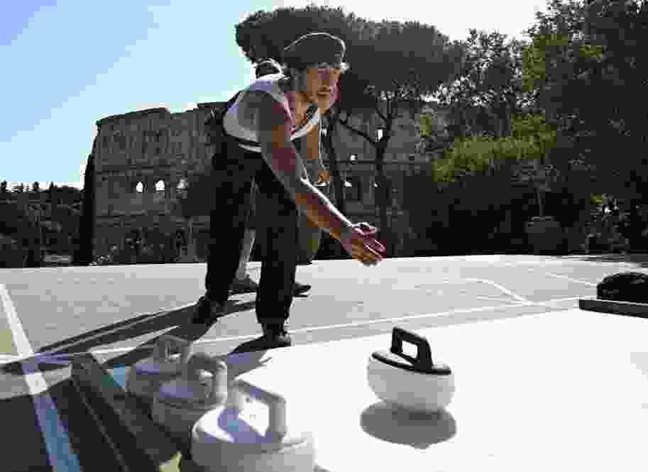 The sport of curling is finding new fans in Rome at a park in front of the Colosseum.