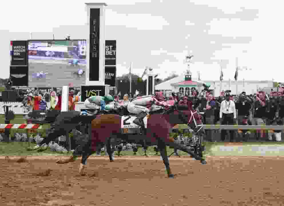 Journalism, ridden by jockey Umberto Rispoli, crosses the finish line first to win the Preakness Stakes at Pimlico Race Course in May.