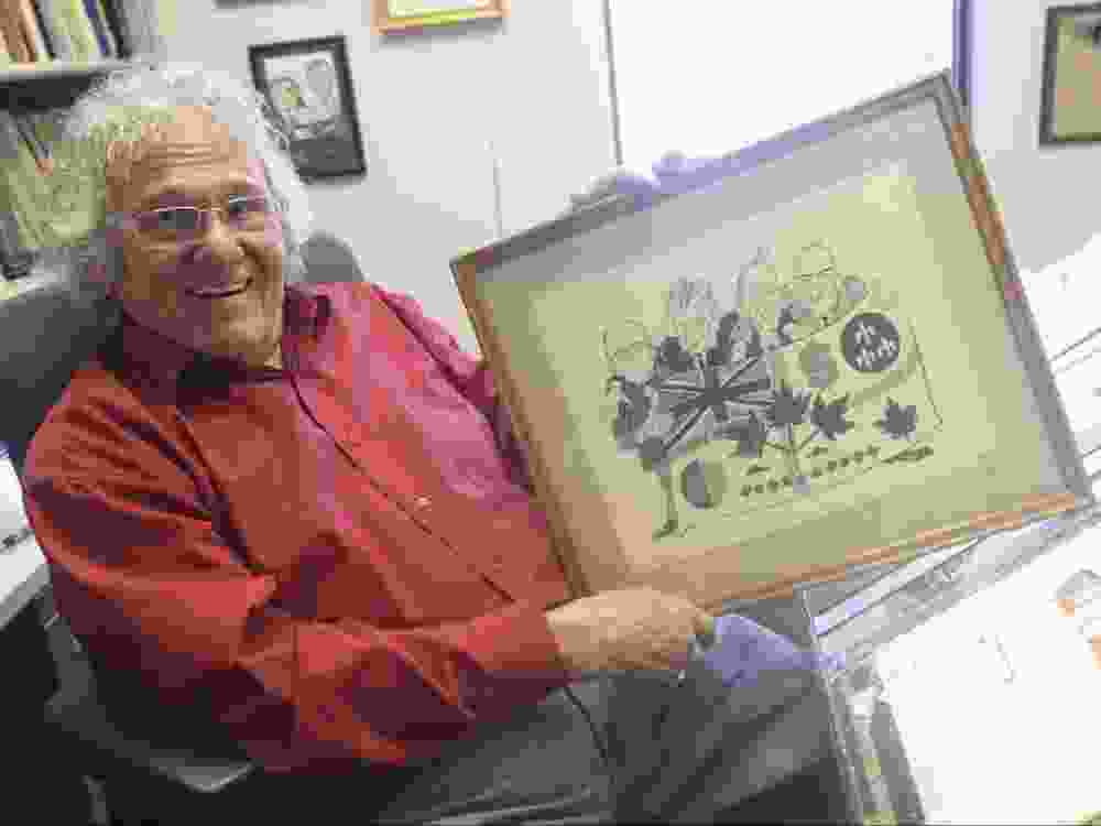 Editorial cartoonist Andy Donato poses