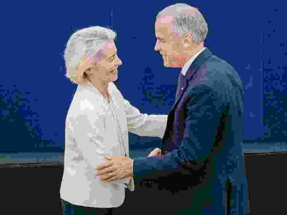 European Commission President Ursula von der Leyen (left) shaking hands with Canada's PM Carney