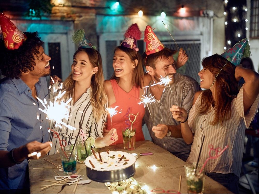 A group of friends at a birthday party.