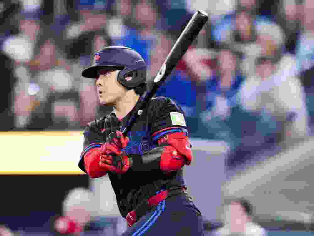 Kazuma Okamoto of the Toronto Blue Jays hits a RBI double