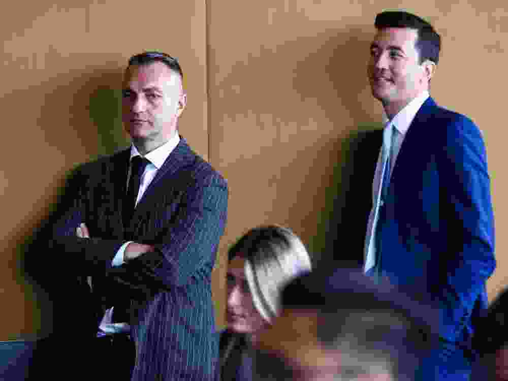 Head coach Darko Rajakovic (left) and GM Bobby Webster of the Toronto Raptors listen to press conferences during the media day at Hotel X.