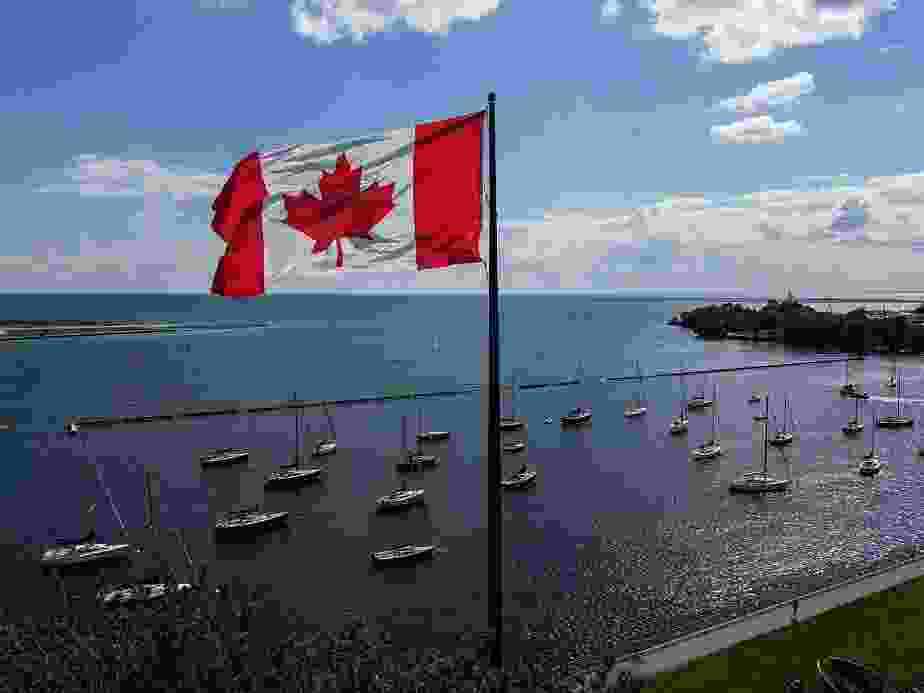 A Canadian flag flies along the waterfront of Lake Ontario, in Toronto, Ontario, Canada, on August 27, 2026.