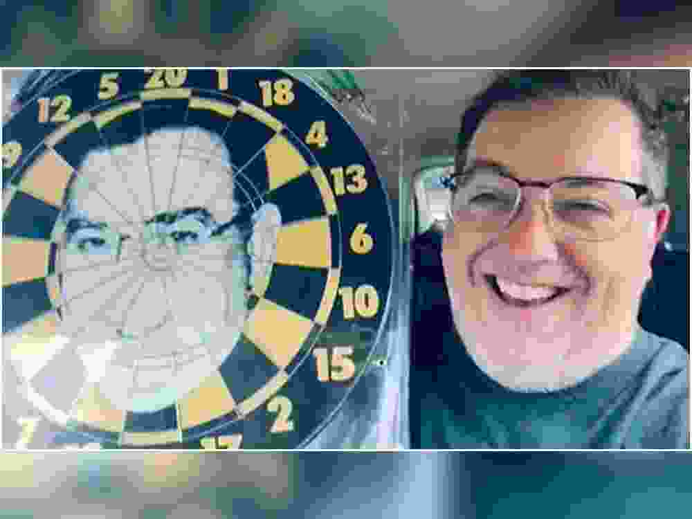 In this screengrab of a video, Guelph's Mayor Cam Guthrie shows off a dartboard he found at a Goodwill in Guelph.