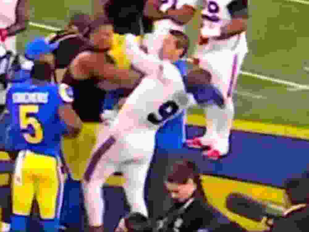 Los Angeles Rams' Alaric Johnson hits Buffalo Bills' Bradley Chubb after Monday's game.