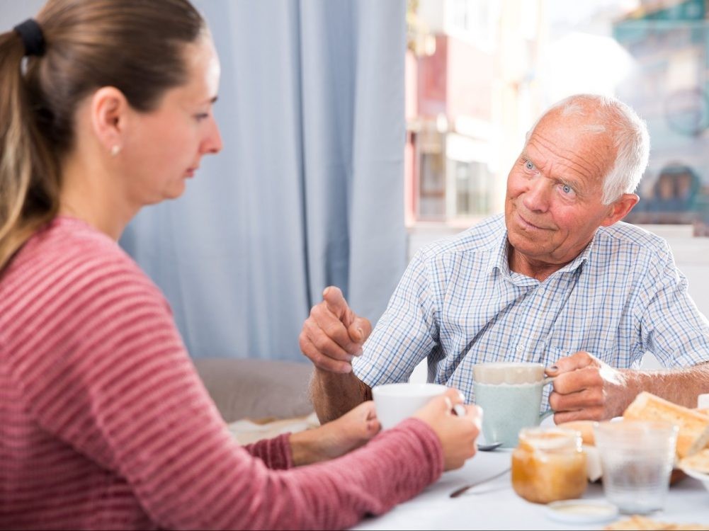Elderly father has a tough conversation with his adult daughter.