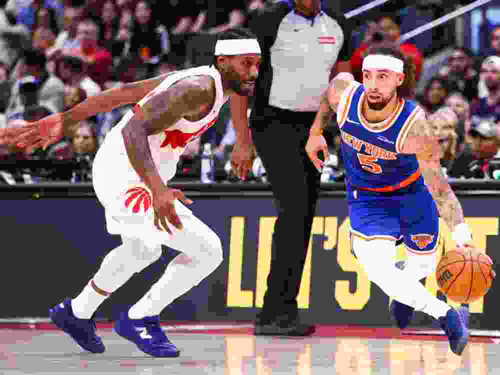 Kawhi Leonard of the Toronto Raptors defends against Jose Alvarado of the New York Knicks during a pre-season game.