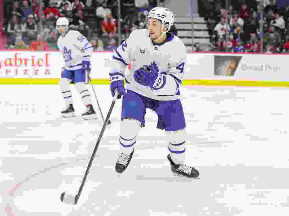 Landon Sim of the Toronto Maple Leafs skates against the Ottawa Senators during a pre-season game.