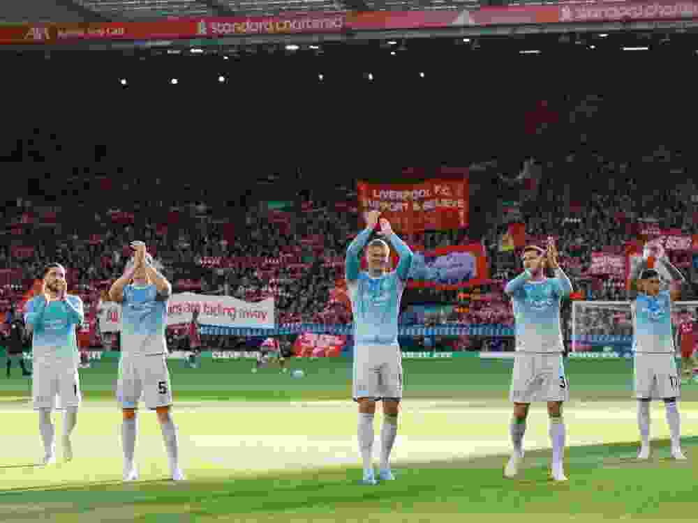 Rayan Cherki, Erling Haaland, Elliot Anderson, Ruben Dias and Enzo Fernandez of Manchester City applaud the fans before a Premier League against Liverpool FC.