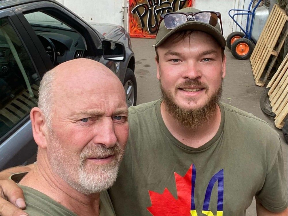 Calgarians Paul Hughes and his son Mac in Kharkiv, Ukraine last month. The two, who've provided humanitarian aid in the war-torn country, are heading into their third winter there. Photo courtesy of Paul Hughes
