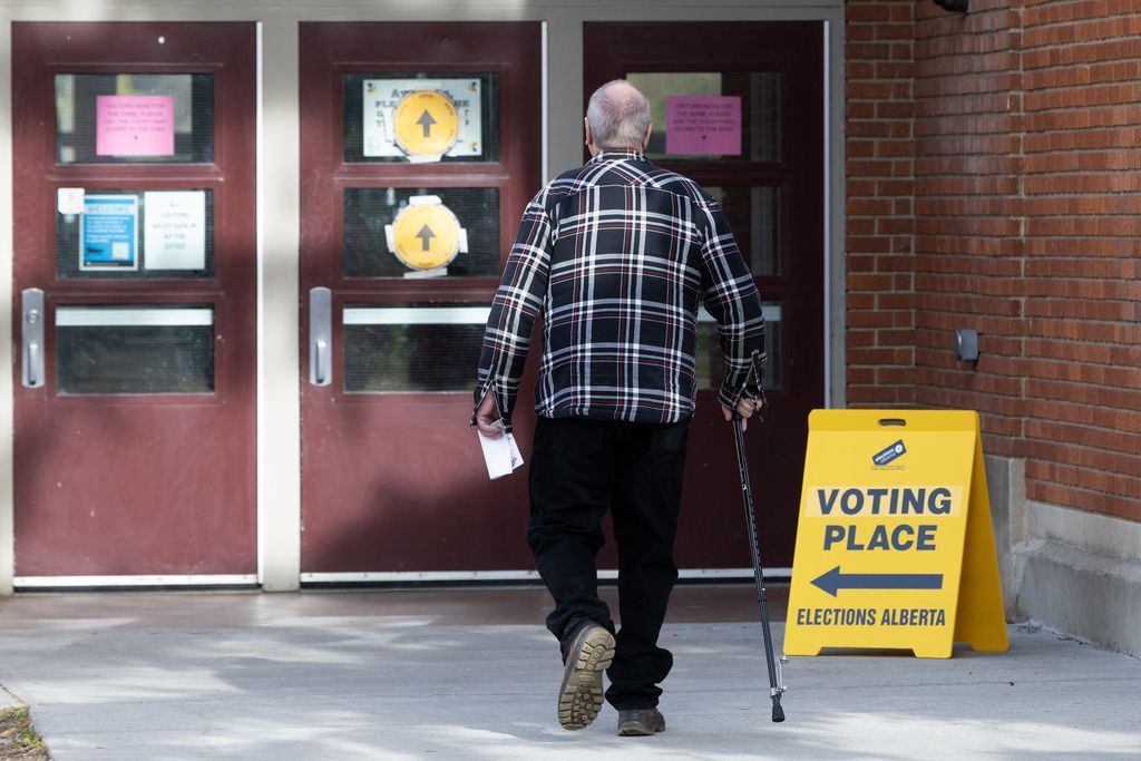 Edmontonians head into an Alberta Referendum polling station at Westminster School, in Edmonton Monday Oct. 19, 2026. Photo by David Bloom