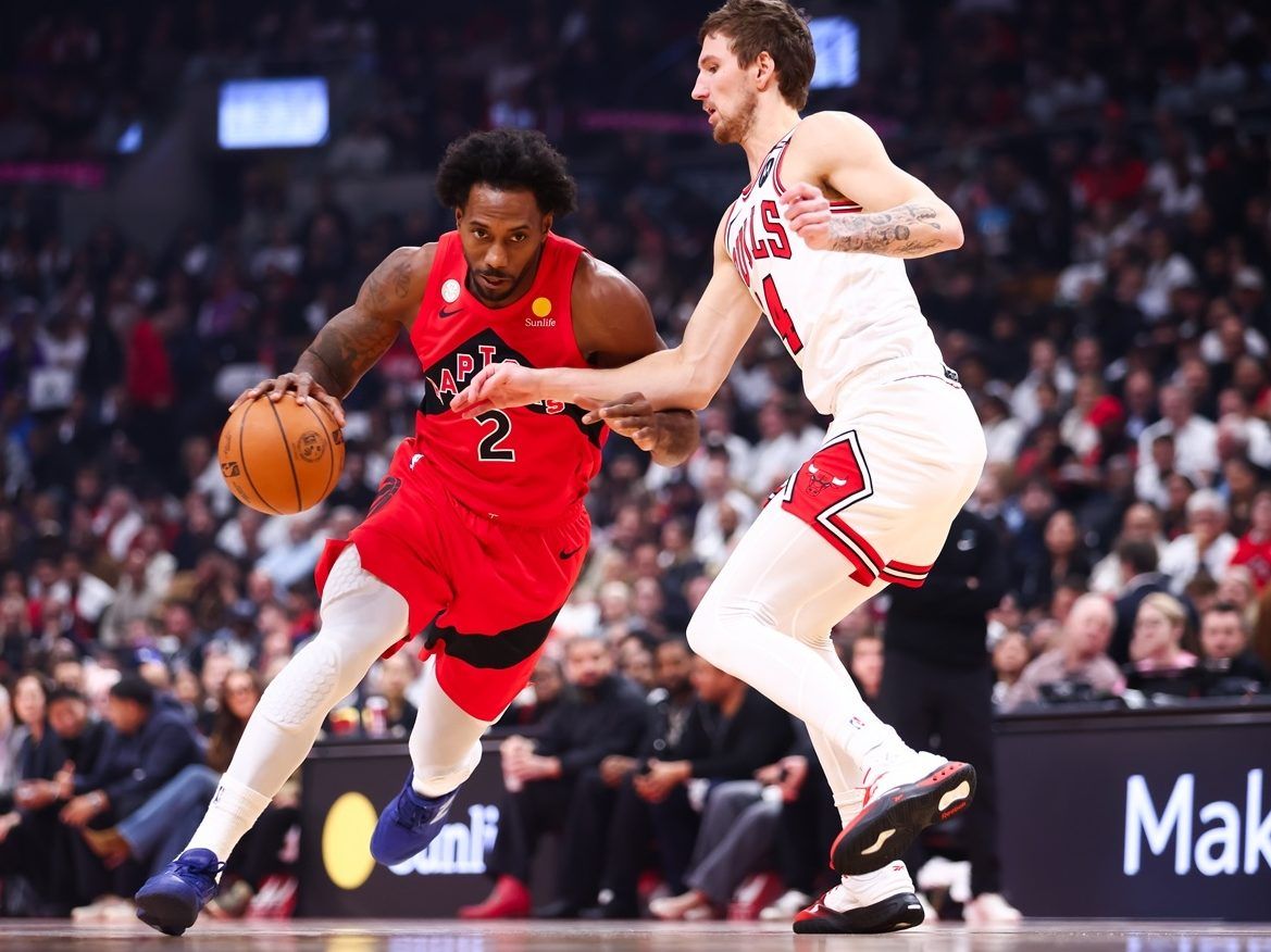 Kawhi Leonard of the Toronto Raptors drives against Matas Buzelis of the Chicago Bulls.