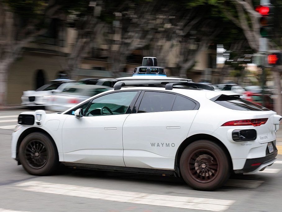 A Waymo robotaxi drives in North Beach on July 07, 2026 in San Francisco, California.