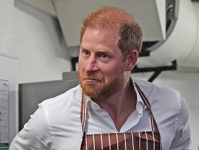 Britain's Prince Harry, Duke of Sussex, reacts during a visit to the Himmah Hub, a food poverty community action group in Nottingham, central England on October 15, 2026.