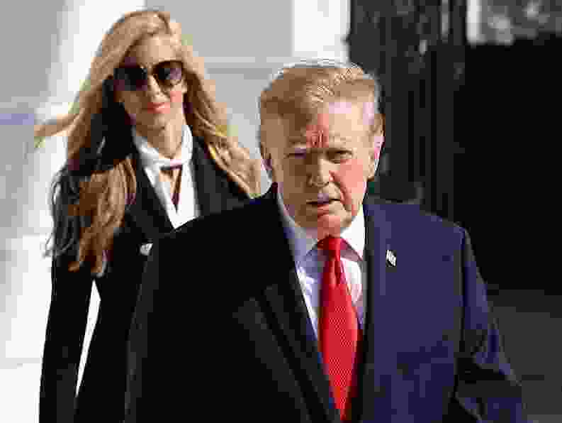 White House Press Secretary Katie Zacharia (L) joins U.S. President Donald Trump as he departs on the South Lawn of the White House on October 13, 2026 in Washington, DC.