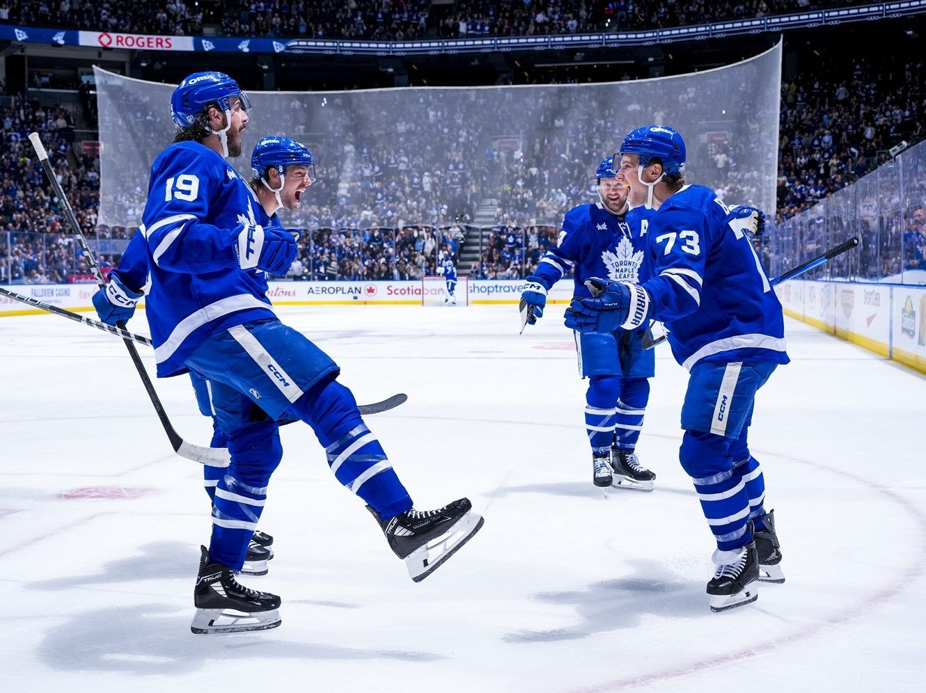 Teddy Blueger of the Toronto Maple Leafs celebrates a goal with his teammates.