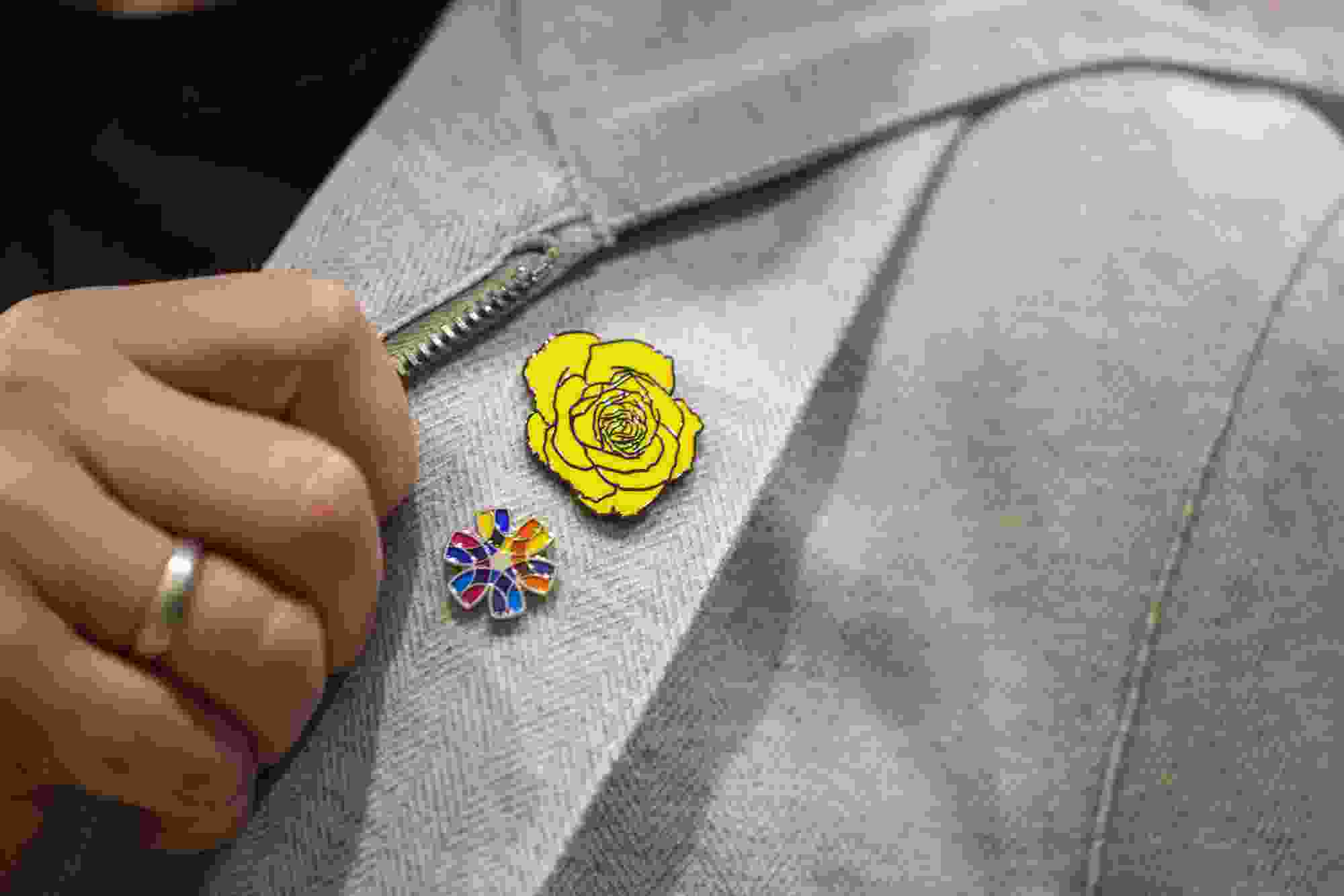 Canadian country music artist and anti-human trafficking advocate Paul Brandt shows off a yellow rose pin after addressing media as Peel Regional Police launched an anti-human trafficking strategy and announced an investment to strengthen survivor supports in Brampton, Ont., on Thursday Oct. 15, 2026. The yellow rose is the symbol for #NotInMyCity, a Canadian charitable organization founded by the country music singer.
