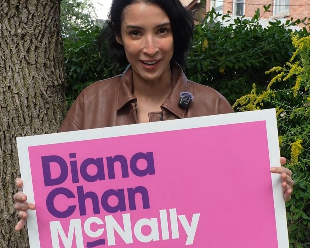 Diana Chan McNally with sign