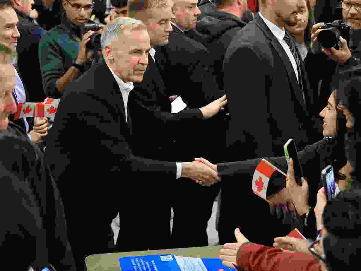 Prime Minister Mark Carney visits with students during the lunch hour at the University of Calgary on Thursday, Oct. 15, 2026. He was set to speak at a Forever Canadian rally at the BMO Centre Thursday night.