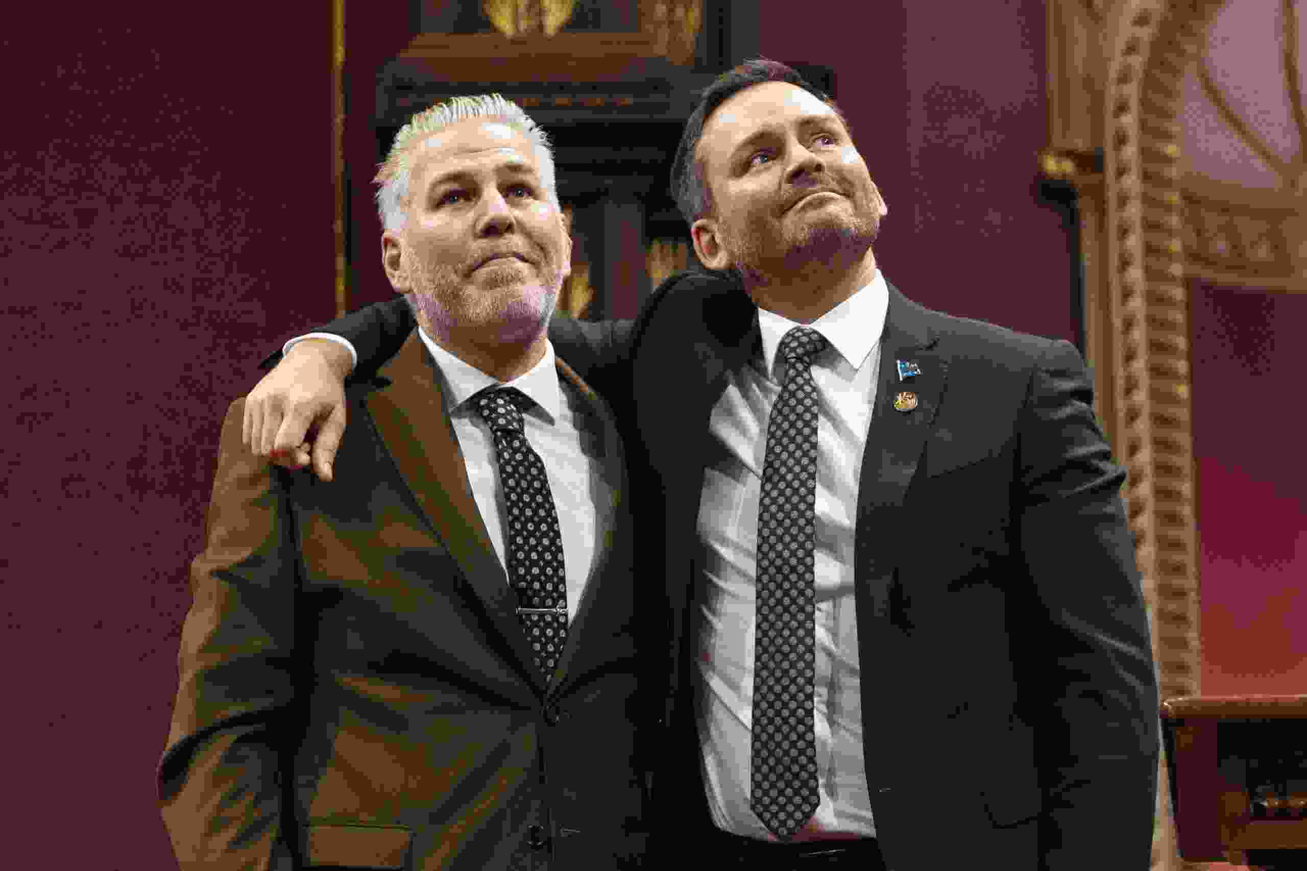 Pascal Bérubé, left, and Paul St-Pierre Plamondon share a moment during an emotional swearing-in ceremony for party members at the National Assembly in Quebec City on Thursday, Oct. 15, 2026.