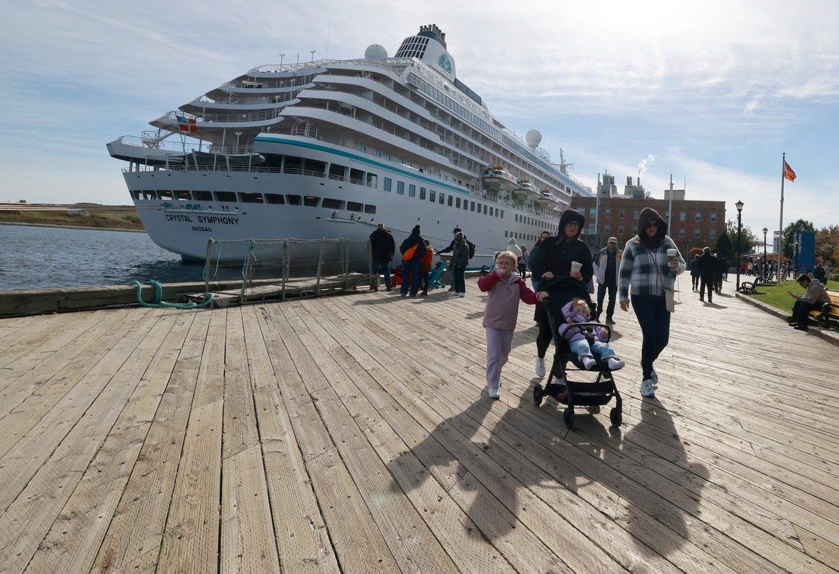 Passengers from the cruise ship Oasis of the Seas walk along the Halifax waterfront on Wednesday.