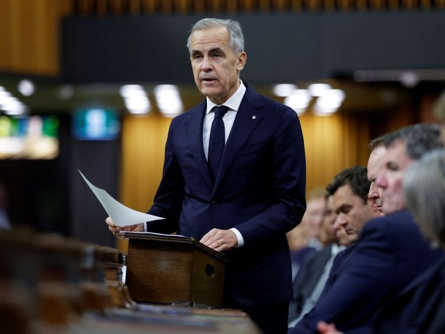 Prime Minister Mark Carney reads a tribute to the Canadian Armed Forces members who were killed and injured in a fire at Canadian Forces Base Wainwright, in the House of Commons on Parliament Hill in Ottawa, Ontario October 19, 2026.